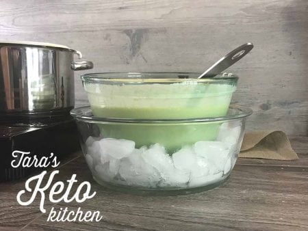 keto vanilla ice cream custard in a bowl that is sitting on top of a bowl of ice